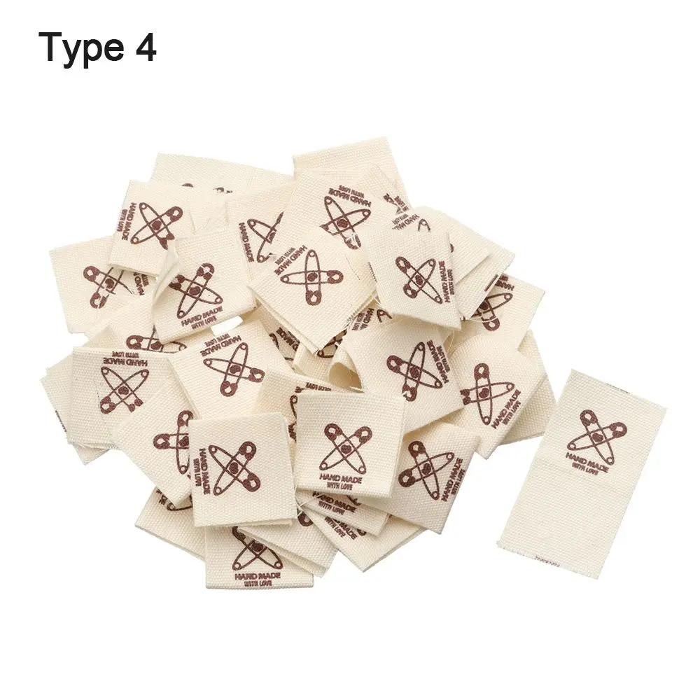 50 pçs pano vestuário etiquetas de vestuário feito à mão padrão dos desenhos animados tecido de malha costurar tags artesanal diy costura artesanato suprimentos - Image 1