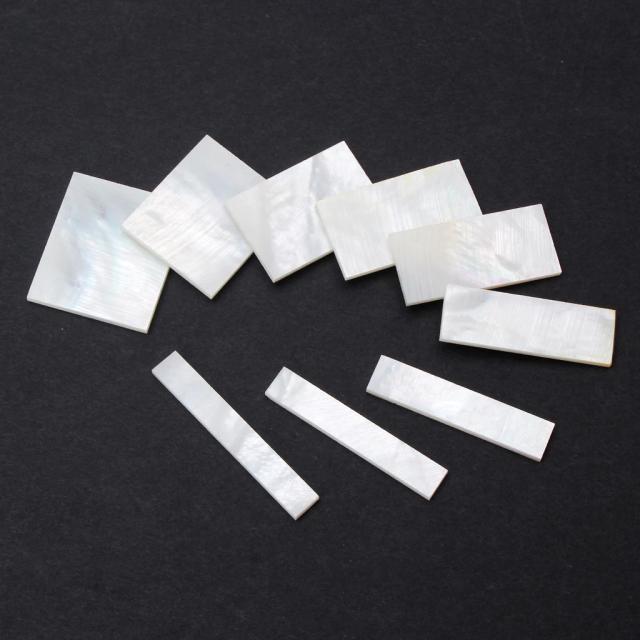 Inlays de Mãe de Pérola Branca para Guitarra: Acessórios Elegantes para o Seu Instrumento Musical