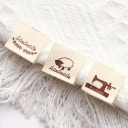 50 pçs pano vestuário etiquetas de vestuário feito à mão padrão dos desenhos animados tecido de malha costurar tags artesanal diy costura artesanato suprimentos - Image 1