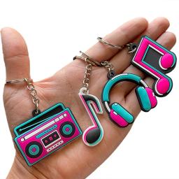 12 peças Lembrancinhas para festa musical, decorações dos anos 80, chaveiro de silicone, rolo de nota musical, fontes de festa temáticas, rádio, fone de ouvido em formato - Image 1
