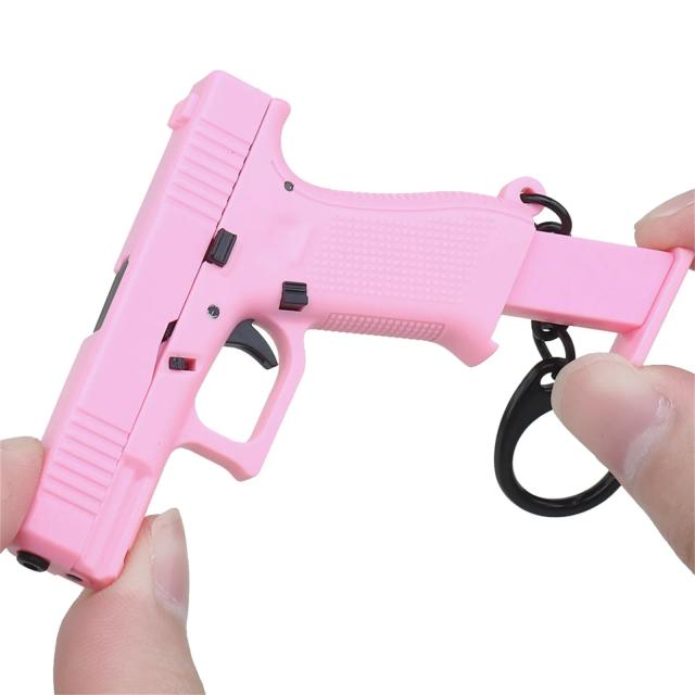 Chaveiro Miniatura de Pistola com Revista Removível - Modelo Realista e Personalizável 2024