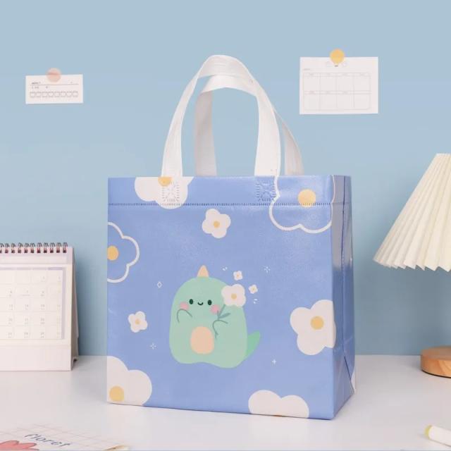 Saco de presente em papel com designs de desenhos animados, punho portátil e impermeável - ideal para festas de aniversário e chás de bebê, 1 unidade.