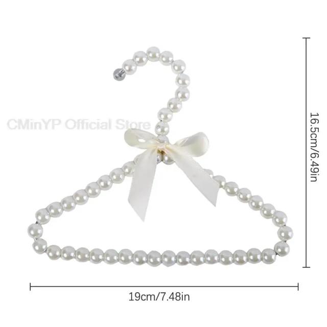 Cabide Decorativo com Pérolas em Forma de Arco para Roupas de Animais de Estimação - Ideal para Cachorros e Gatos, Acessório de Guarda-Roupa com 1 Unidade