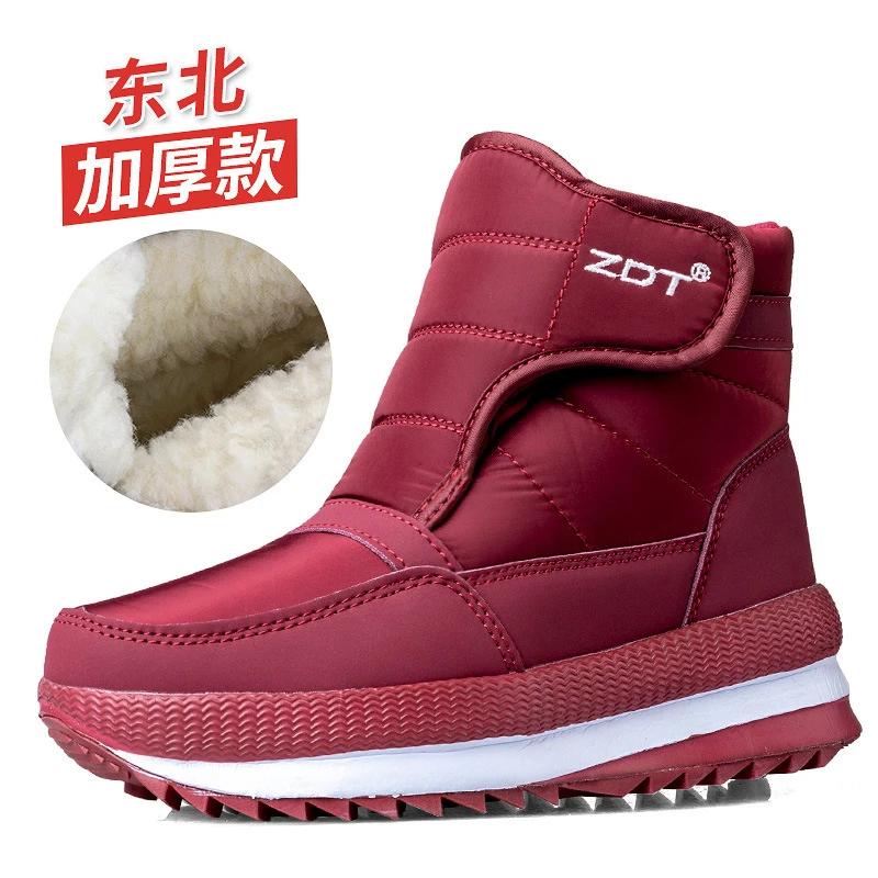2024 inverno novo engrossado e quente casal grandes sapatos de algodão mais veludo casual tubo curto masculino e feminino tamanho grande botas não-ski - Image 1