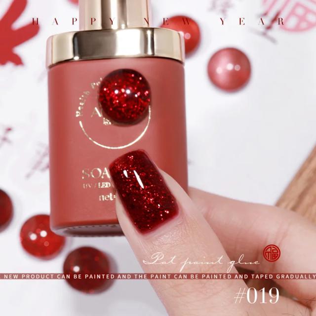 Esmalte Gel Art Design: Verniz UV Magnético em Vinho Vermelho e Rubi com Efeito Olho de Gato e Cola Brilhante